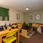 Premium student accommodation Lancaster, cosy student house to rent lancaster. Vibrant student living room in Lancaster with smart TV and comfy sofa, ideal for student accommodation in Lancaster.
