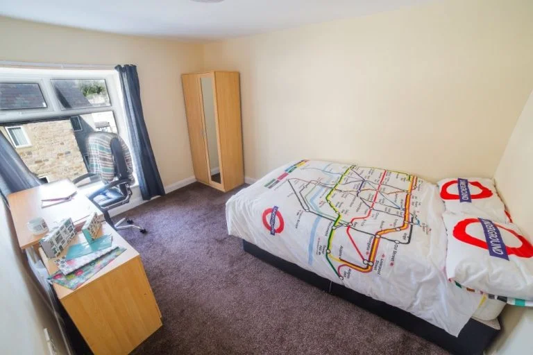Penny Street student bedroom with bed, study desk, wardrobe and window