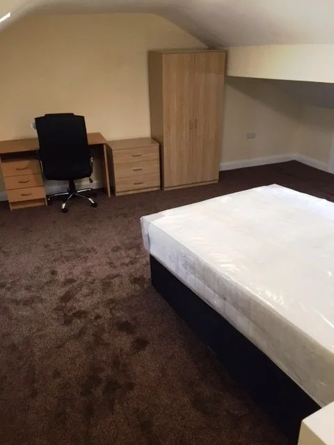 Penny Street attic student bedroom with bed, desk, drawers and wardrobe